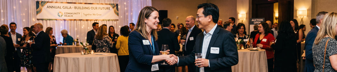 A non-profit employee shaking hands with a donor at a fundraising event.