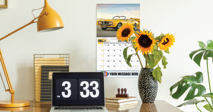 Decorative setup with a laptop displaying '3 33', sunflowers in a vase, and a calendar on a desk.