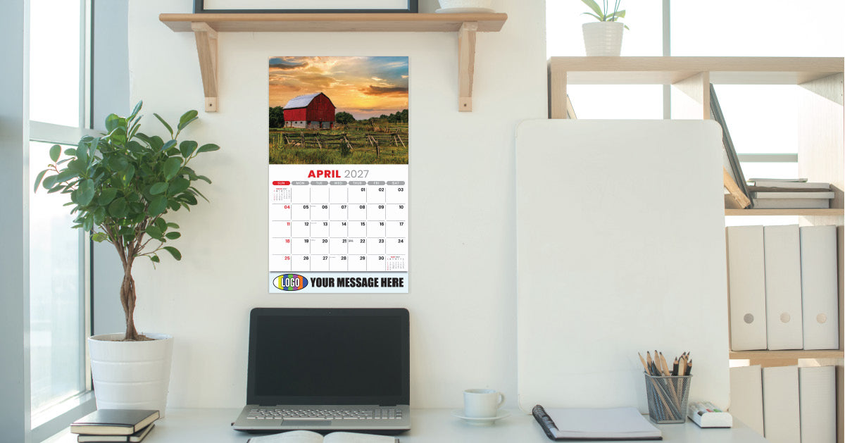 Promotional Calendar on a desk with a laptop and office supplies, featuring a scenic April calendar design.