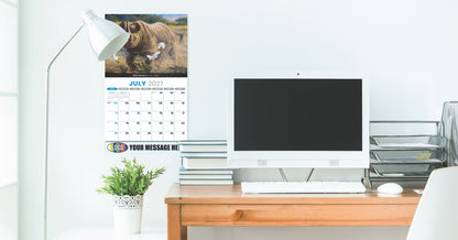 Modern office desk with computer monitor, promotional calendar, and lamp.